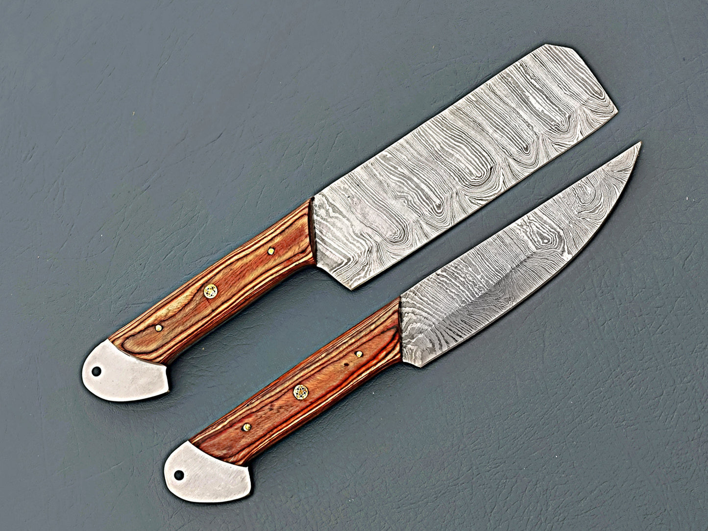 brown and silver Damascus knives